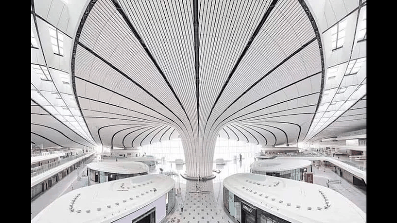 Futuristic Terminal 3 of Shenzhen Bao’an International Airport, its undulating honeycomb shell evoking a soaring manta ray against the sky