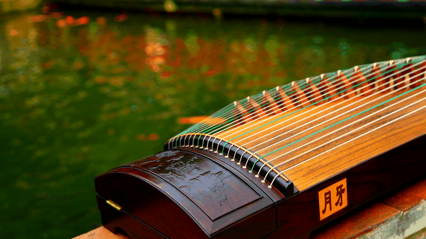 Guzheng (Chinese zither) by a lake.